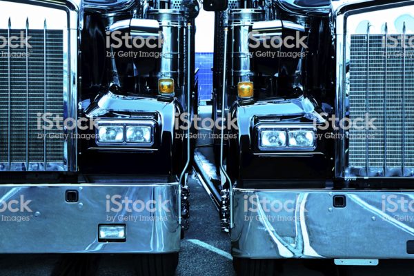 two trucks, cross processed image