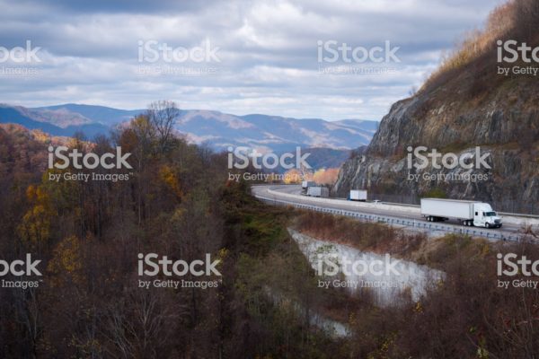 Vehicle traffic, mostly semi trucks, travels on Interstate 26 at Sam's Gap near the Tennessee - North carolina state line.